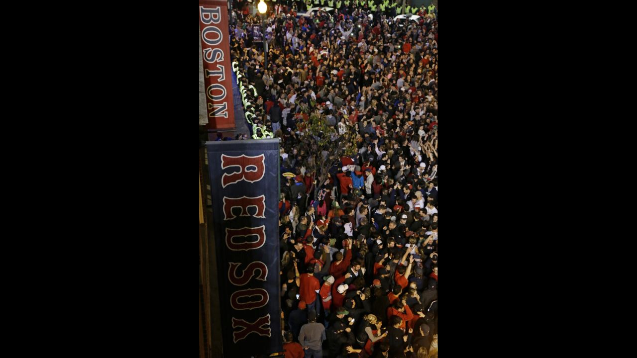 Boston Red Sox fans celebrate after the Cardinals' defeat. 