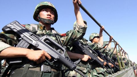 An anti-terrorism force holds exercises in Hami, in northwest China's Xinjiang region in July. 
