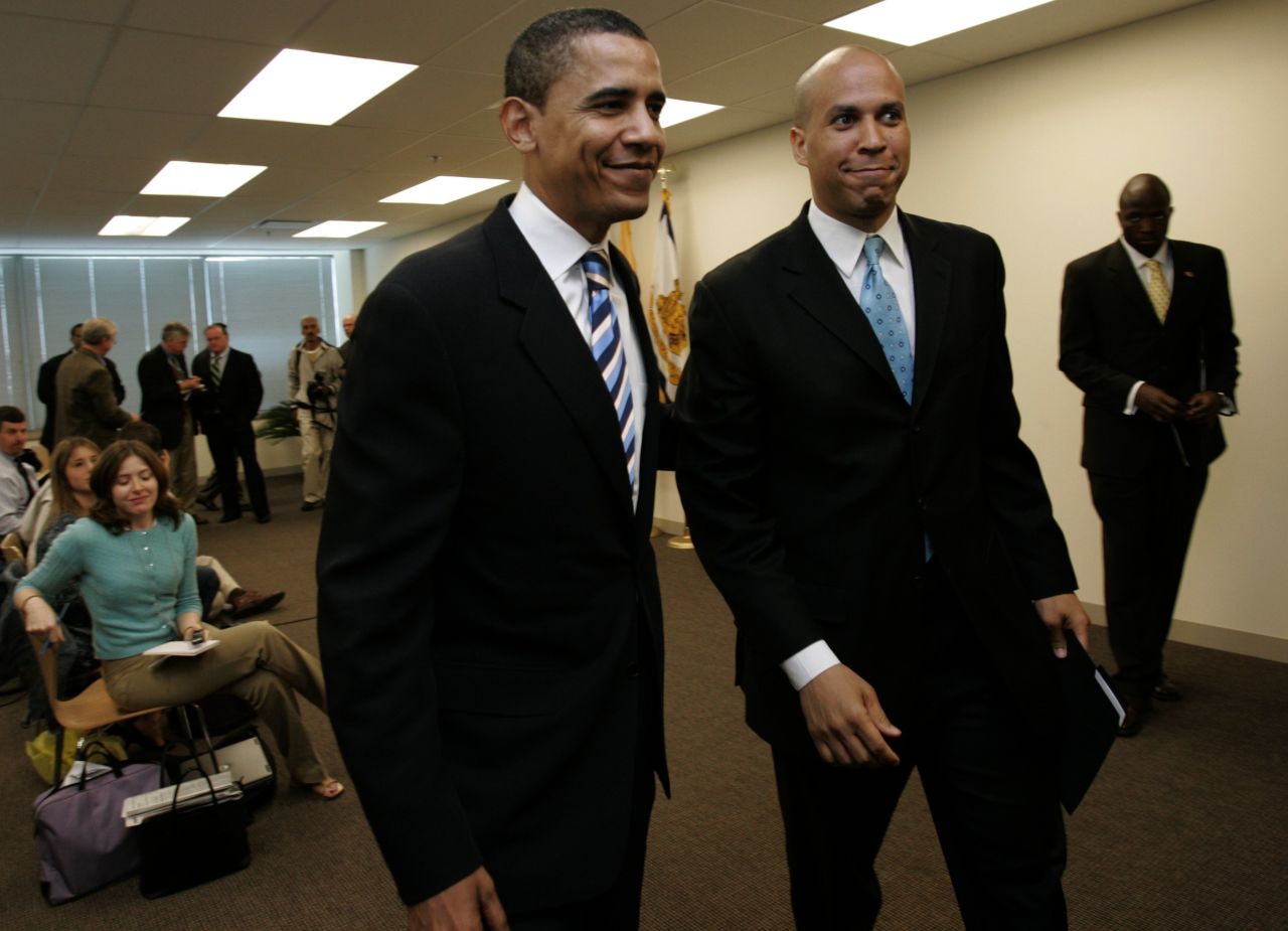 Booker walks with then-Sen. Barack Obama after Booker endorsed Obama at a news conference in Teterboro, New Jersey, in May 2007. 