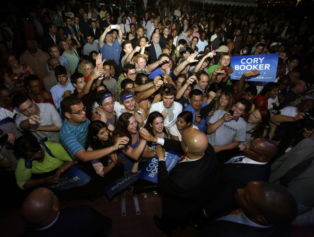 Booker says hello to supporters August 13 in Newark.
