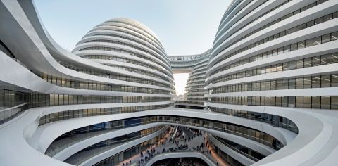 Hadid's biggest office outside of London is in China, so it's unsurprising that she has designed a number of buildings in the country, including the Galaxy Soho entertainment and office complex (pictured), the Guangzhou Opera House in 2010, and the Wangjing SOHO towers complex, set to be completed next year. 