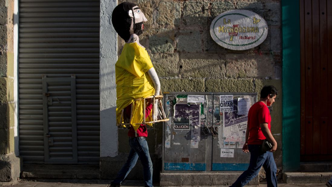 A paper mache costumed character walks through the streets of Oaxaca. "At first, children a bit scared of the costumes and skull painting because they don't know what it means," says Valentin Concha-Nunez, museum educator for El Museo del Barrio in New York. "But when I tell them to touch their craniums they realize that skulls are a part of them and then they embrace that aspect of it."