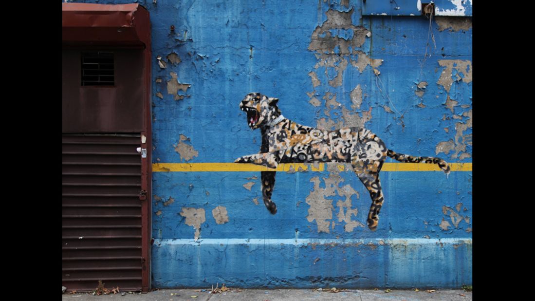 A leopard placed on the wall of New York's Yankee Stadium was revealed in October 2013.