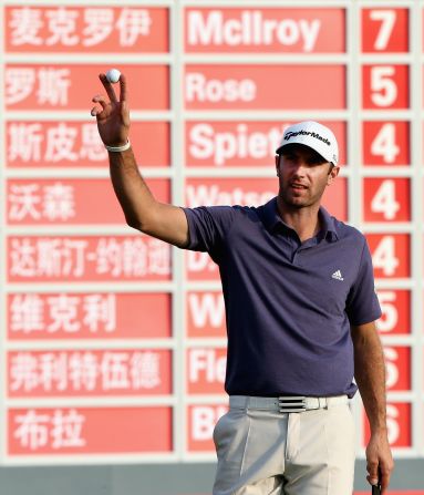 Dustin Johnson acknowledges the gallery after completing his record equaling nine-under 63 in Shanghai.  