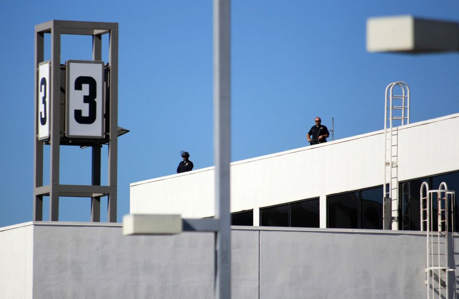 Police officers stand guard atop Terminal 3.