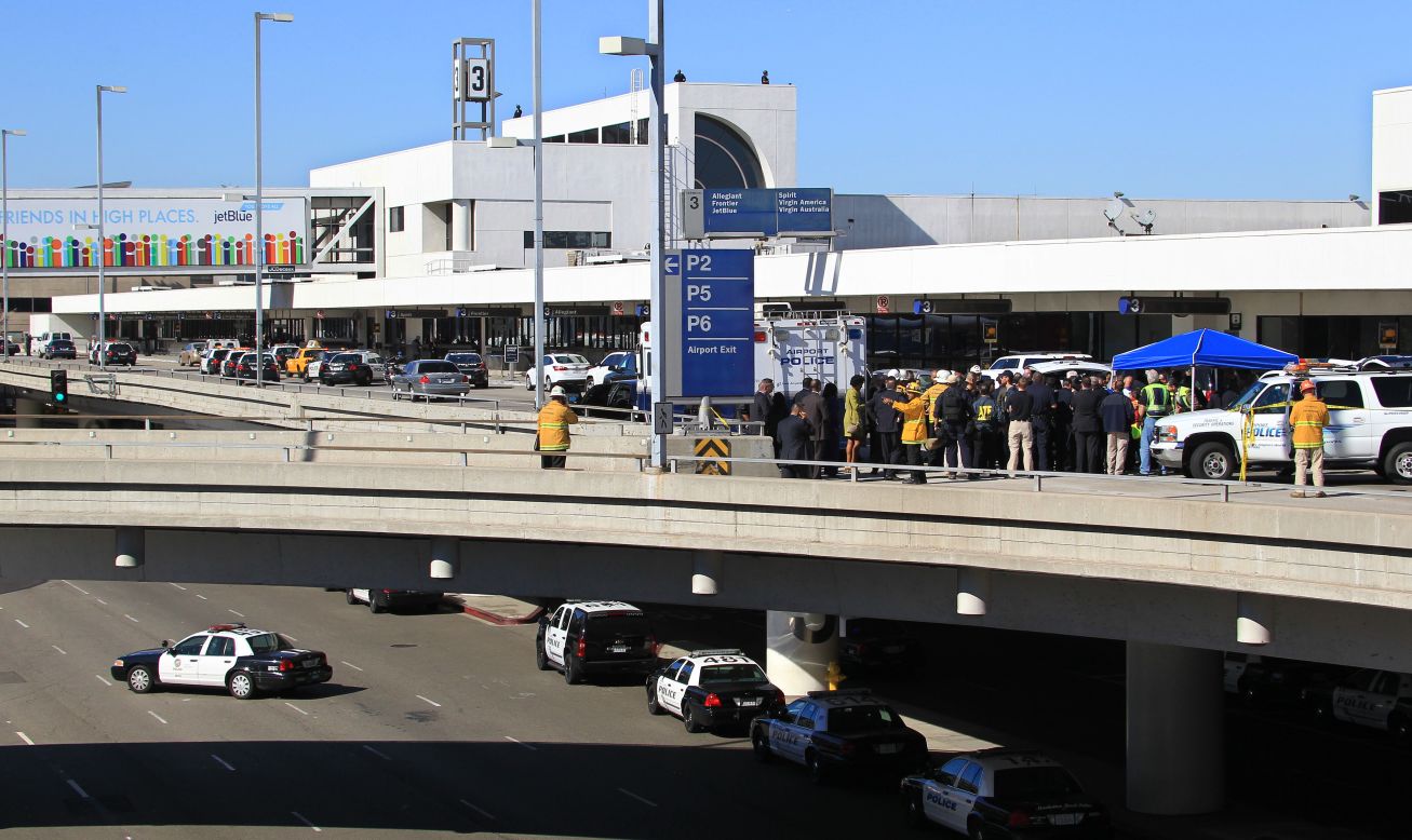 Police officers and emergency response officials meet outside Terminal 3 at Los Angeles International Airport after <a href="http://www.cnn.com/2013/11/01/us/lax-gunfire/index.html">gunshots were reported</a> inside the terminal on November 1.