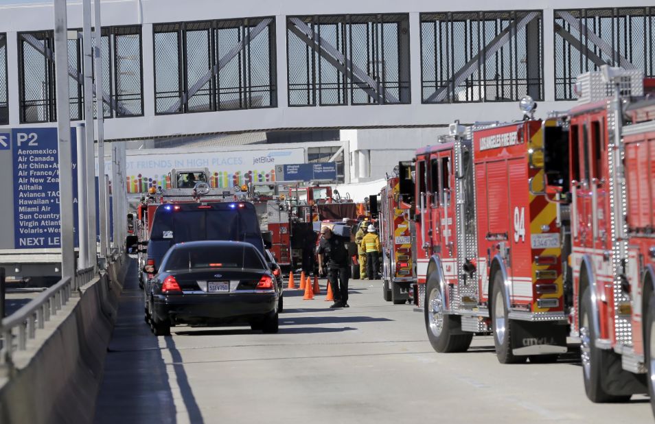 First responders and emergency vehicles arrive at the airport.