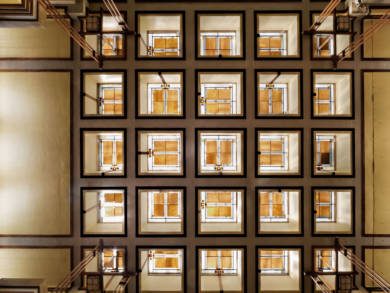 Master architect Frank Lloyd Wright designed Unity Temple, a church in Oak Park, Illinois. He was responsible not only for the building, but for the furniture and the stained glass, seen here in a view of the skylights in the main sanctuary.