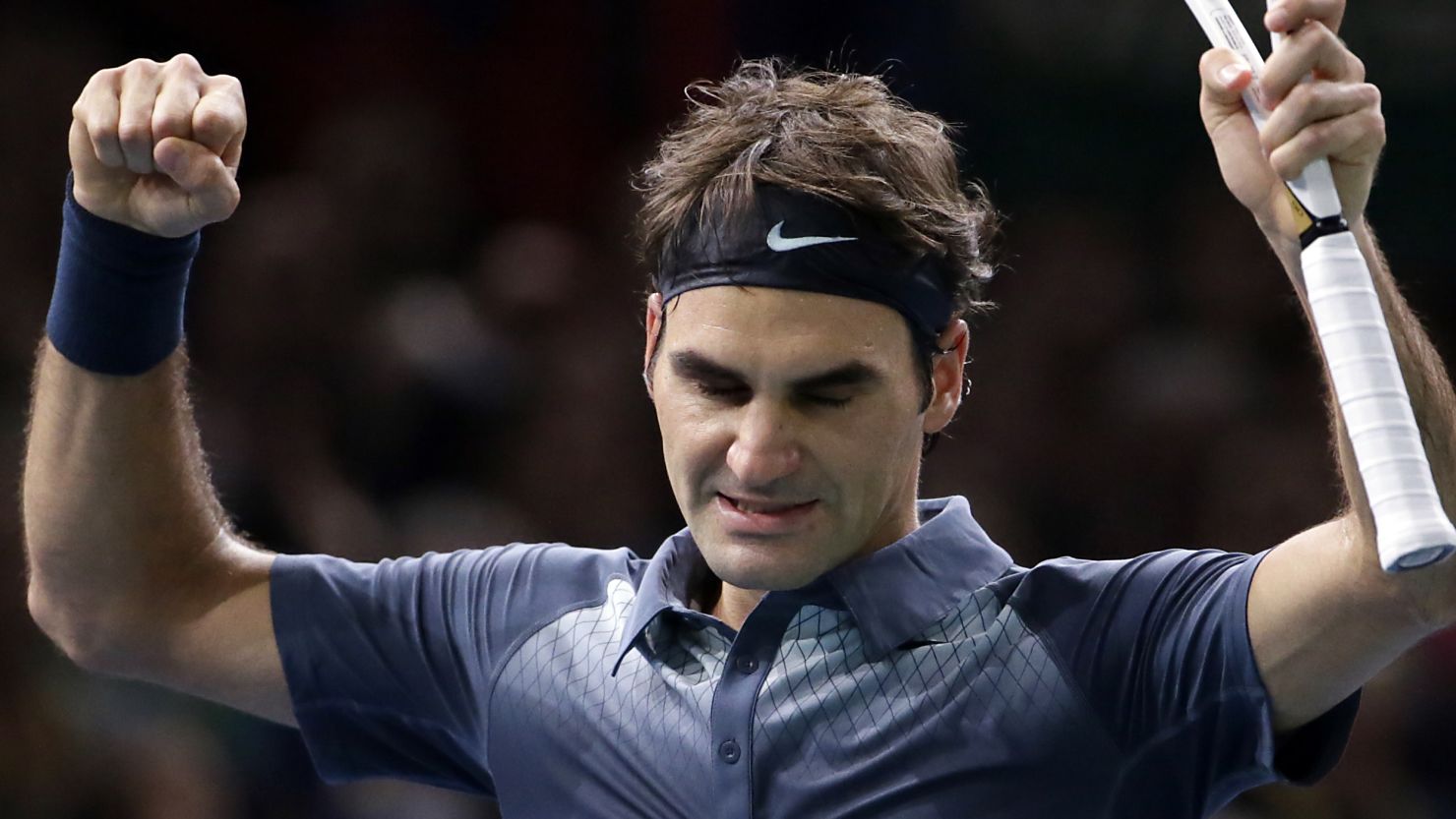 Roger Federer savors his moment of victory against Juan Martin Del Potro in the Paris Masters quarterfinals.