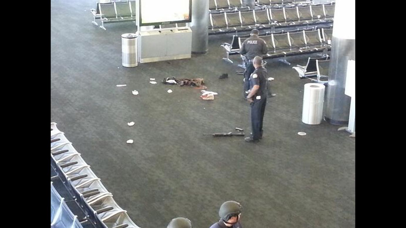 This photo, from Terminal 3, shows what appears to be a weapon on the ground. Police said a man "pulled an assault rifle out of a bag and began to open fire" Friday, killing one person and injuring others before being shot and taken into custody.