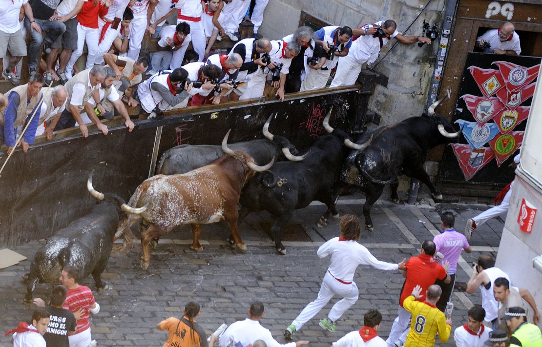 Fences separate the spectators from the bulls in Pamplona.