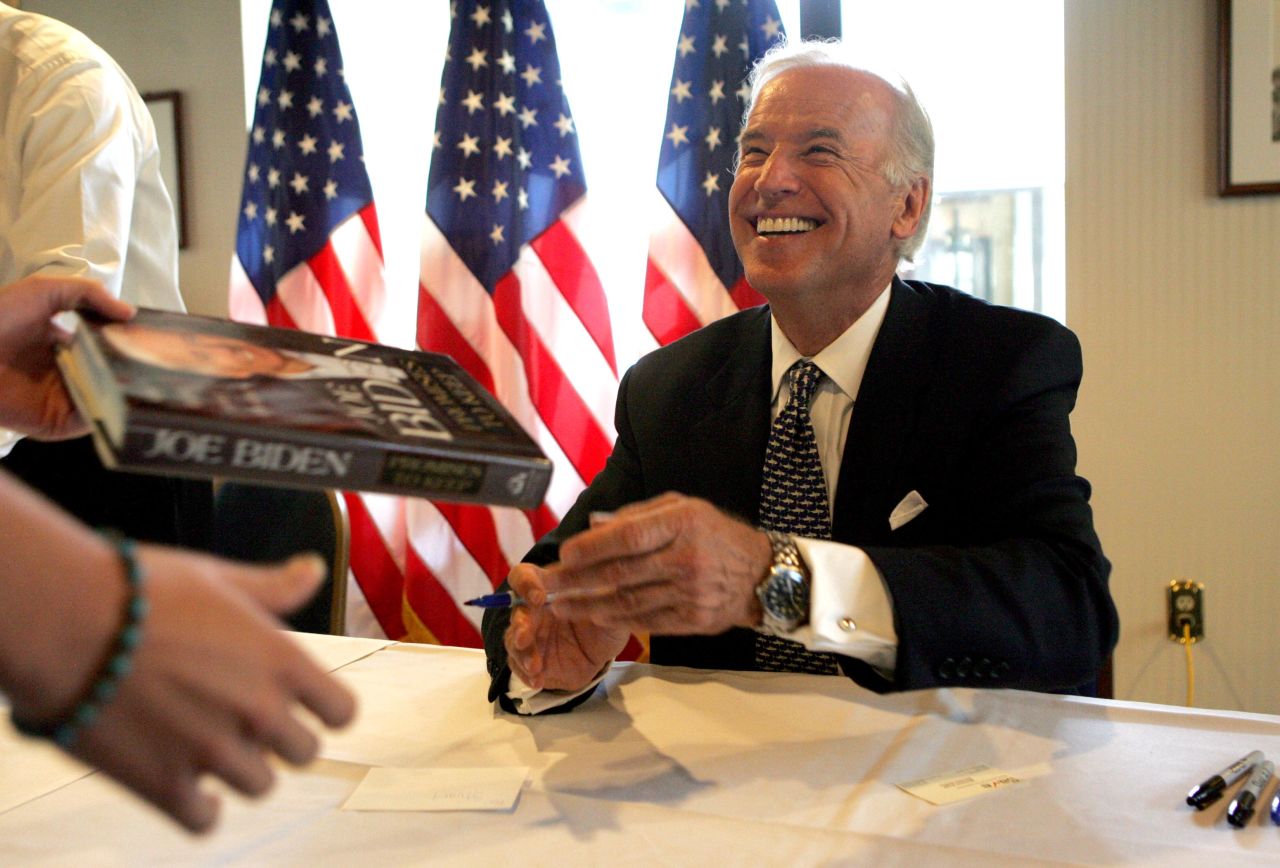 Biden signs his book "Promises to Keep" at the National Press Club in Washington, DC, in 2007.