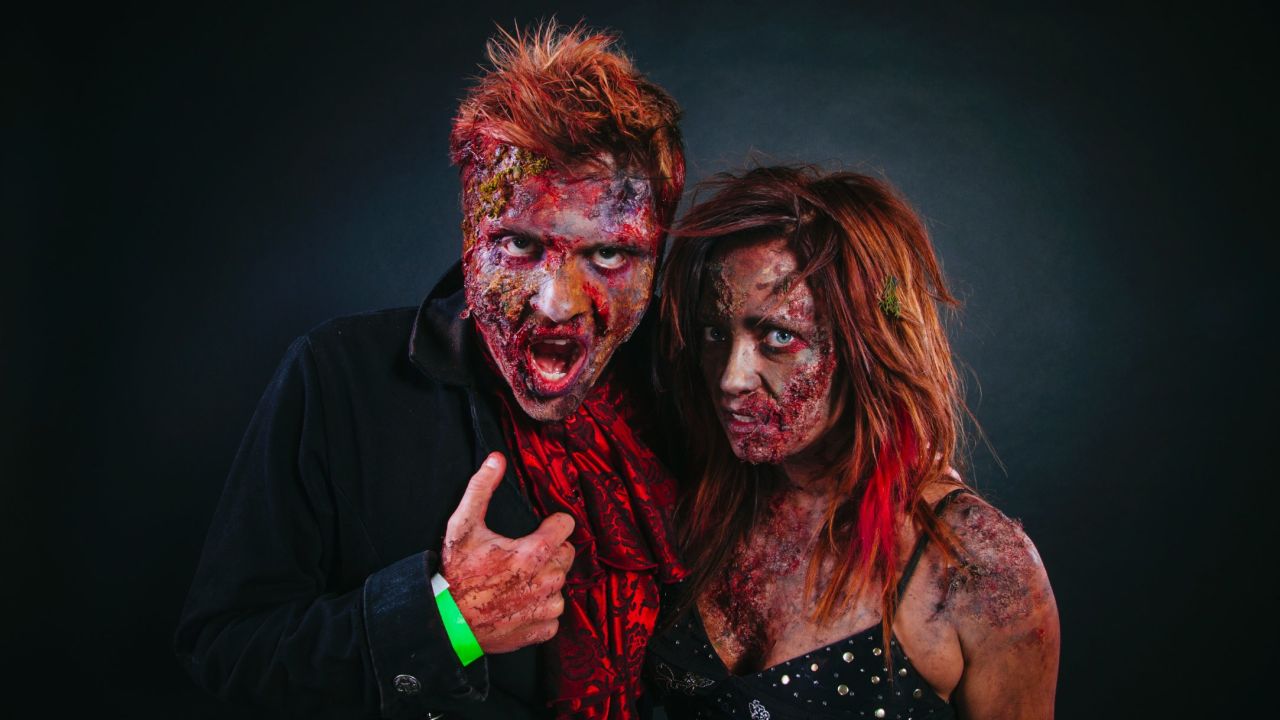 Erik Smoak and Sarah Kostelnik, both big con fans, dressed as zombies.