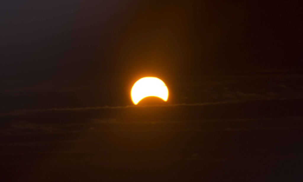 When Luis Figueroa tried to photograph the eclipse from his home in New York City, he discovered the sun was too bright. "So I added my homemade solar filter to [my camera] lens. When I looked through the view finder I was amazed," he said.