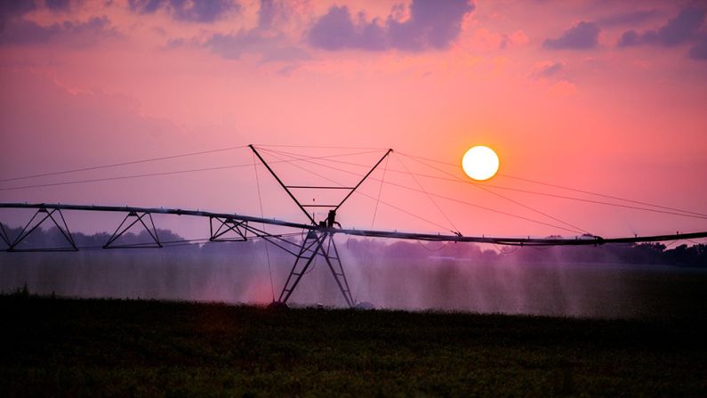 Photographer Dylan Ozanich caught the beauty of daily life across the country, including this sunset over an evening watering of the crops along Highway 60 in the Mississippi Delta.