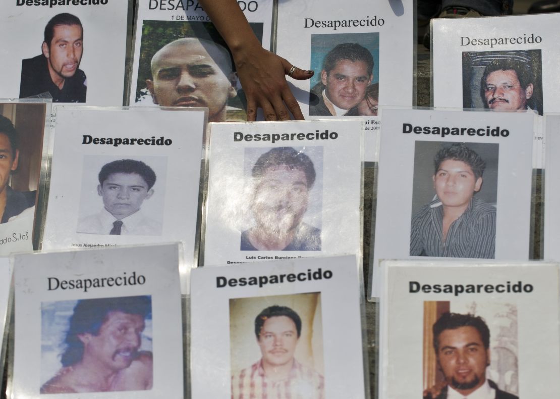 Some of the dozens of portraits of people missing in Mexico's drug war are displayed during a recent protest in Mexico City.