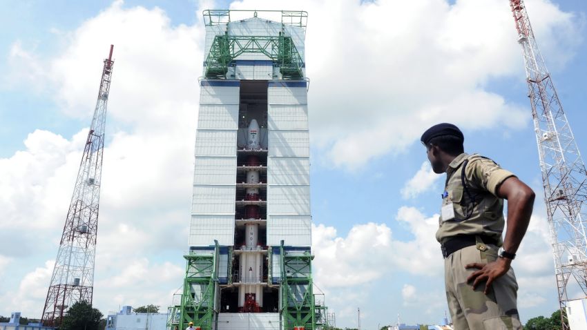 This photograph taken on October 30, 2013 shows an Indian security forces member keeping watch near the PSLV-C25 launch vehicle, carrying the Mars Orbiter probe as its payload, at the Indian Space Research Organisation facility in Sriharikota, ahead its planned launch on November 5. The unmanned probe, weighing 1.35 tonnes and about the size of a large refrigerator, will leave earth strapped to an Indian rocket which is set to blast off from the south-east coast on November 5 afternoon. AFP PHOTO/STR (Photo credit should read STRDEL/AFP/Getty Images)