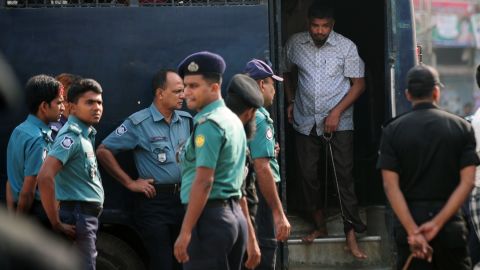 Handcuffed Bangladesh Rifles (BDR) soldiers arrive at the special court in Dhaka on November 5, 2013.