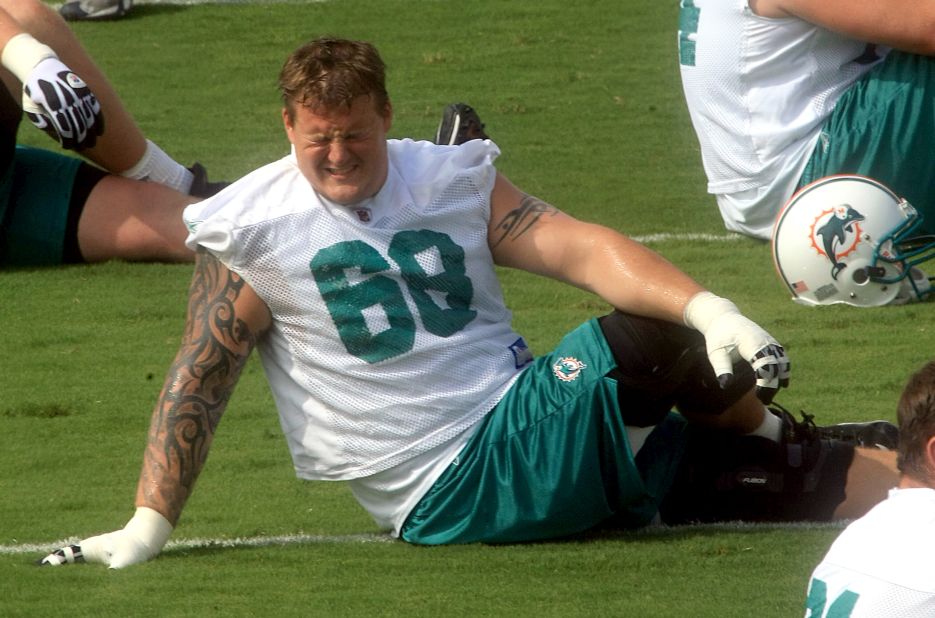 Incognito stretches during the last day of Dolphins minicamp in June 2010. 