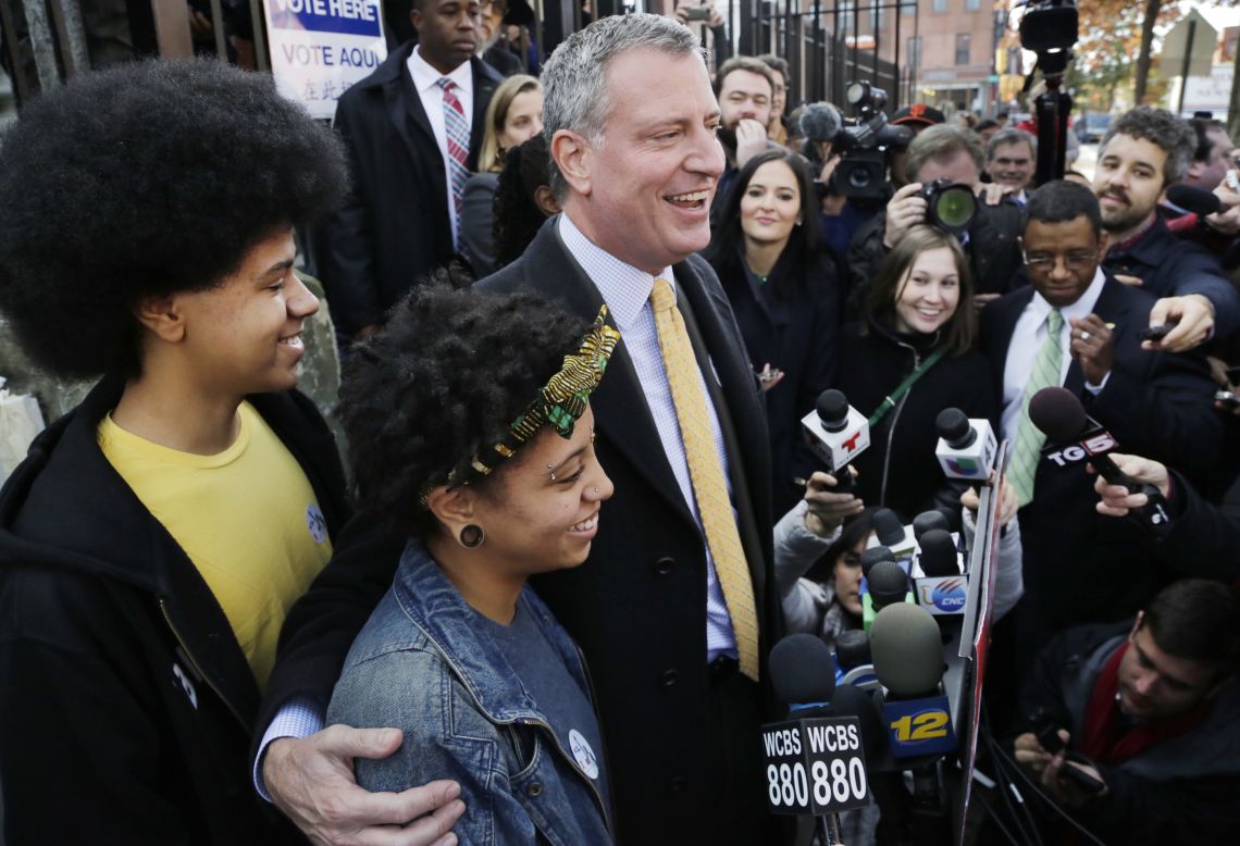 Democratic mayoral candidate Bill de Blasio appears with his children, Dante and Chiara, as he talks to the media after voting in the Park Slope neighborhood of Brooklyn on Tuesday, November 5. De Blasio defeated Republican Joe Lhota by a 73%-24% margin with 91% of the vote in, making him the first Democrat to lead the nation's largest city in a generation.
