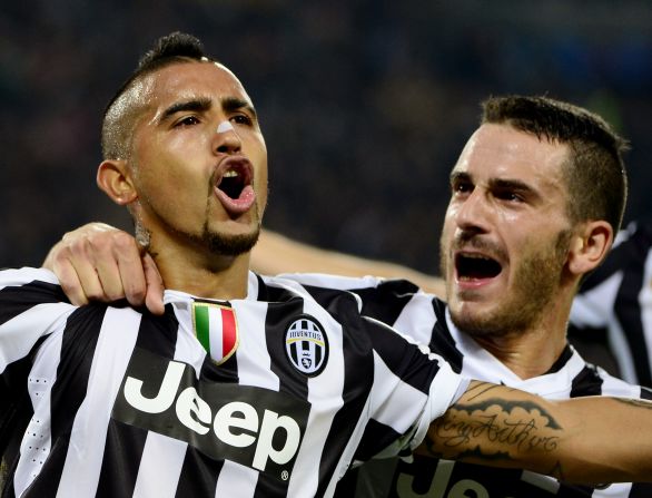 Arturo Vidal is congratulated by Leonardo Bonucci after putting Juventus ahead from the spot against Real Madrid.