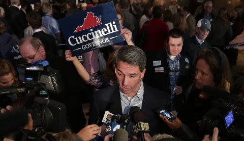 Cuccinelli answers questions from the media during a campaign stop the day before elections in Warrenton, Virginia.