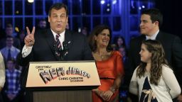 Republican New Jersey Gov. Chris Christie signals second term as he stands with his wife, Mary Pat Christie, second right, and their children, Andrew, back right, Bridget, right, as they celebrate his election victory in Asbury Park, N.J., Tuesday, Nov. 5, 2013, after defeating Democratic challenger Barbara Buono. (AP Photo/Mel Evans)