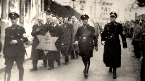 Nazi SS forces escort arrested Jewish men in Baden-Baden, Germany.