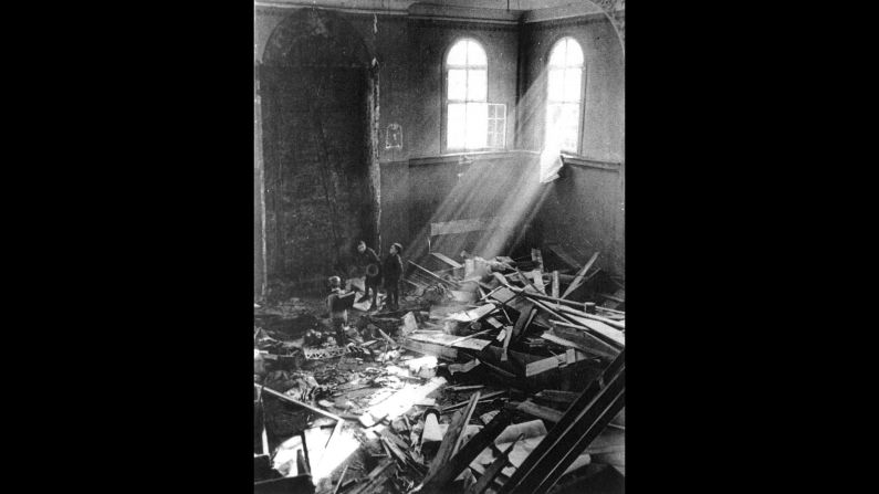 Children sift through debris in a ruined synagogue in Koenigsbach, Germany.