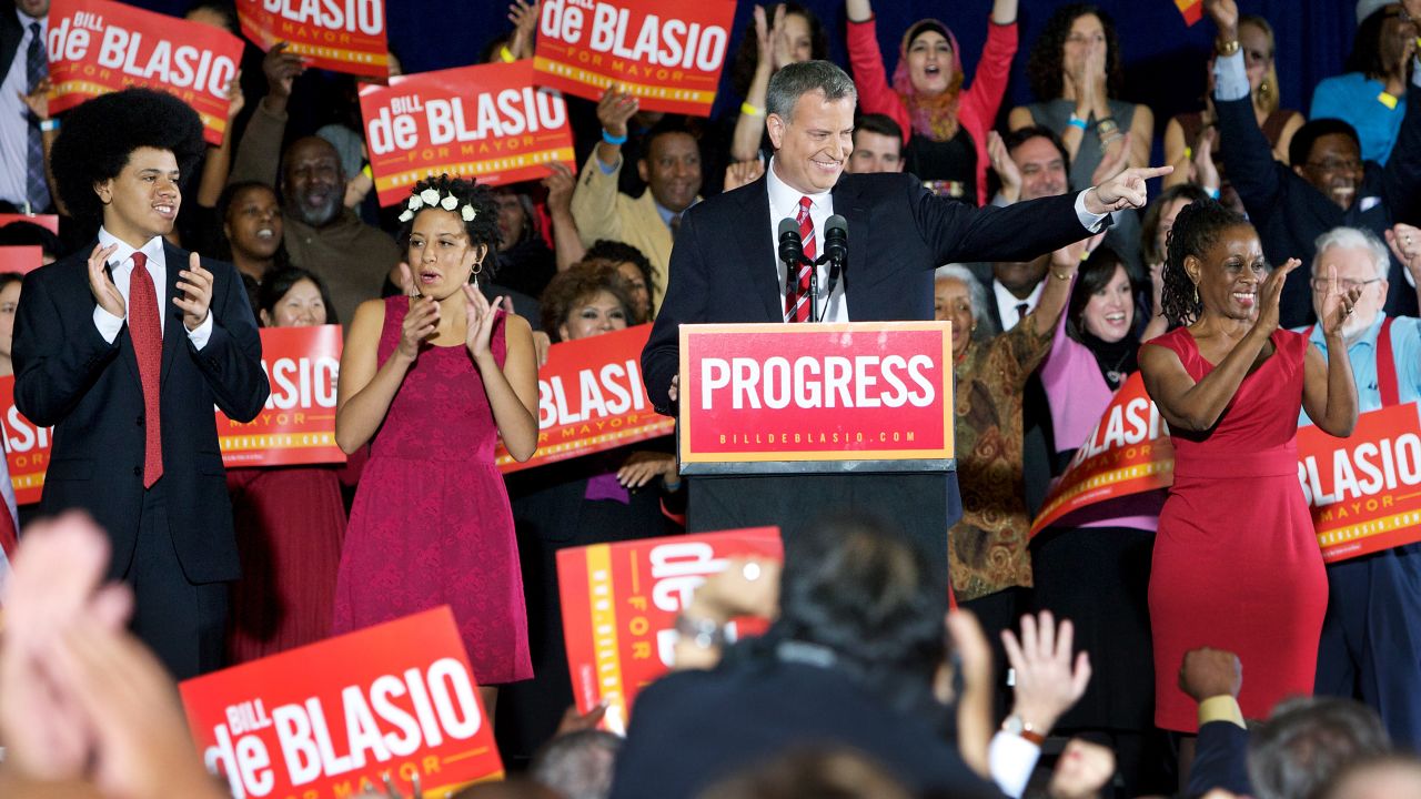 New York Mayor-elect Bill de Blasio celebrates his victory on Tuesday, November 5, with supporters and his children Dante, left, and Chiara, second left, and his wife, Chirlane McCray, right.