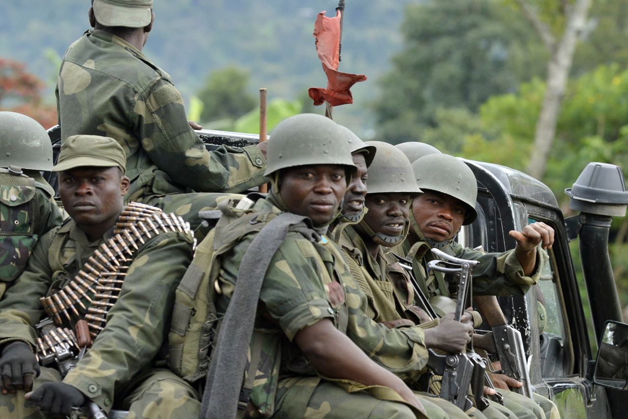 Military successes in the Democratic Republic of Congo have led the M23 militia group to announce its intention to disarm.<br />Pictured, army soldiers head towards the Mbuzi hilltop, near Rutshuru, on November 4, 2013, after the army recaptured the area from M23.