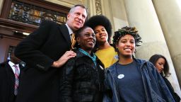 New York Mayor-elect Bill de Blasio poses with his family, wife Chirlane McCray, son Dante and daughter Chiara, after voting on Election Day.