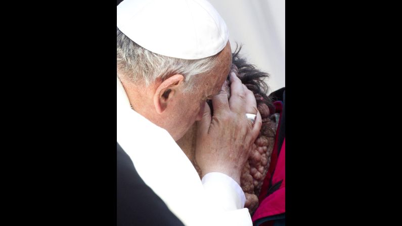 He reportedly took the man's face in his hands, kissed him and gave him a blessing.