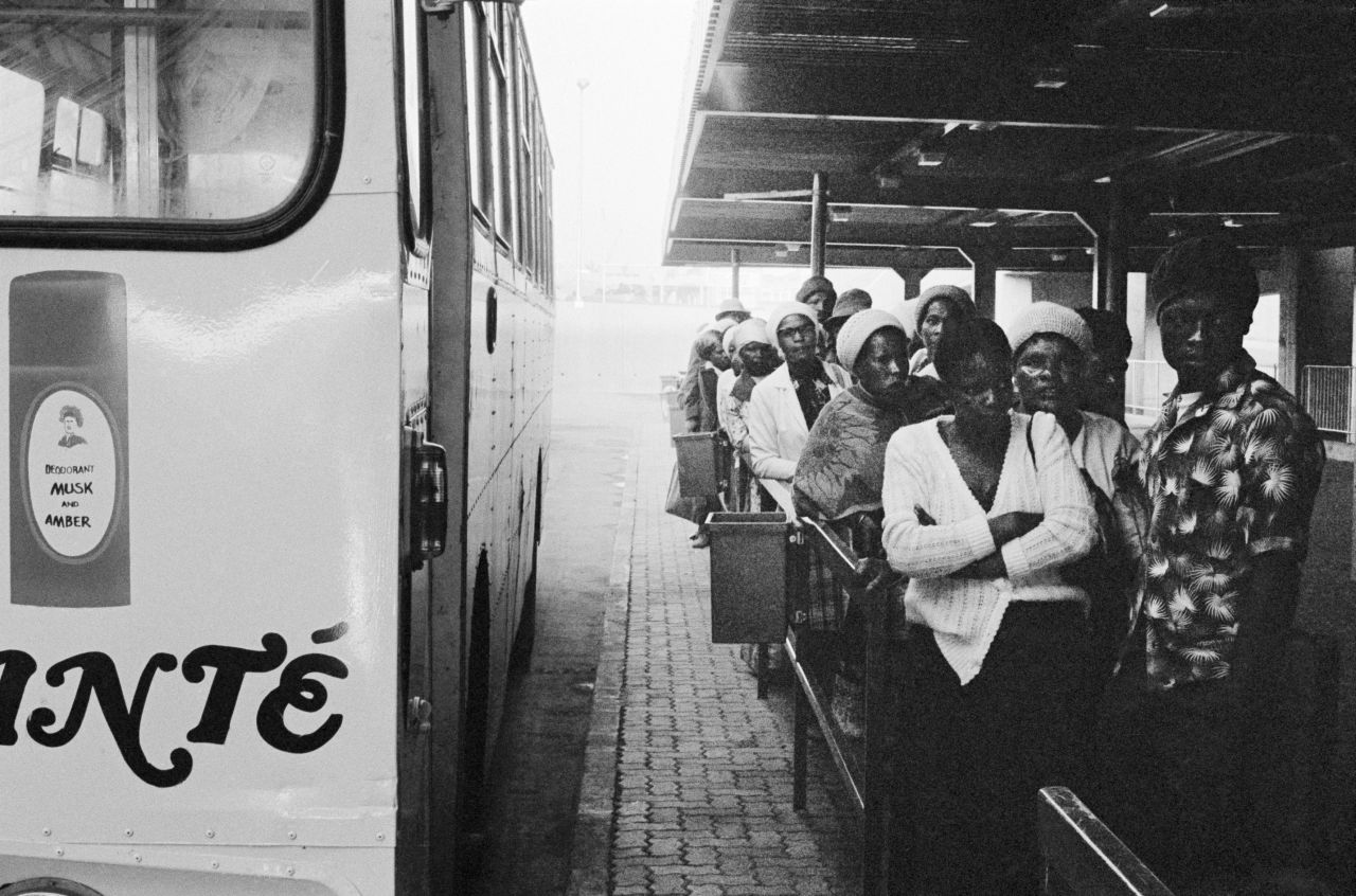 5:40 am: Passengers wait to board local buses at Marabastad terminal in Pretoria en route to work for the day. Because of racial segregation, many were forced to travel up to eight hours a day to get to and from work in the city.