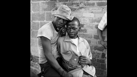Photographed in November 1972 in Soweto, two young men show their "dompas" -- an identity document that every African had to carry.