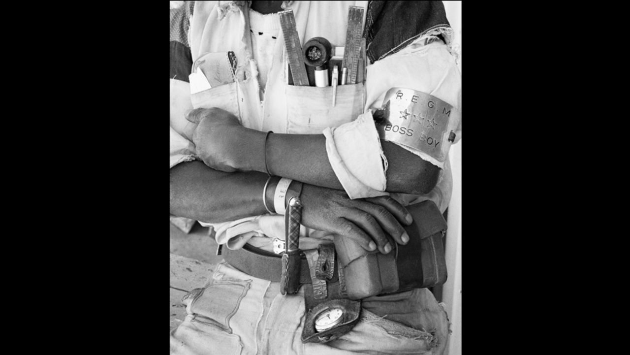 Goldblatt has also taken an extensive set of photographs documenting mining in South Africa. Here Goldblatt has focused on the detail on the uniform of a mine overseer (or Boss Boy). It was taken in 1966 at the Randfontein Estates Gold Mine.