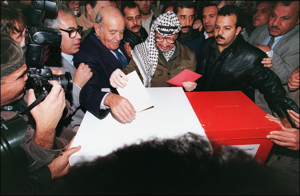 Arafat casts his ballot in Gaza City on January 20, 1996. Palestinians were voting for the first time in their history to select a president and 88-member council, and Arafat was elected president of the Palestinian National Authority.