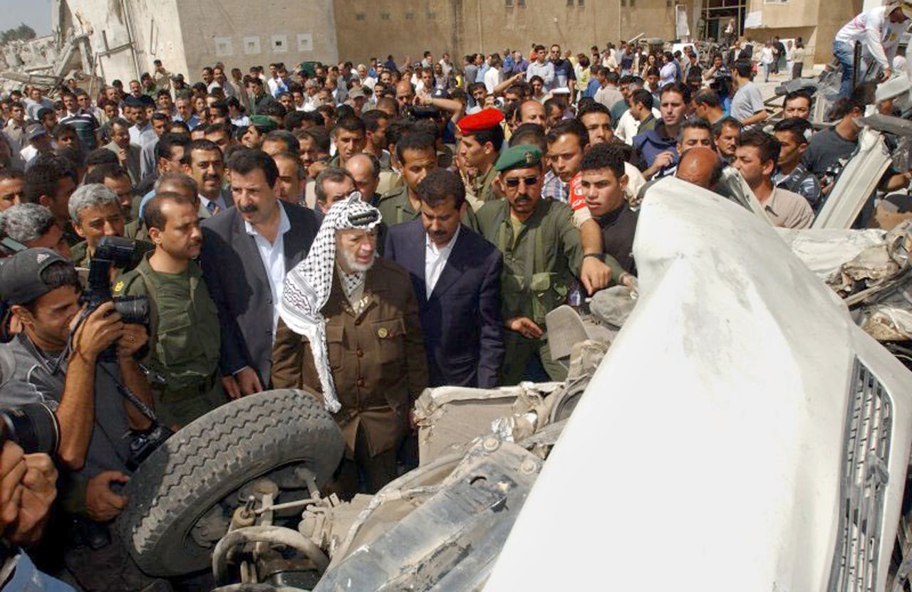Arafat tours damage at his compound after it was attacked by Israeli troops on June 6, 2002 -- this time in retaliation for a suicide bombing that killed 17 Israelis, 13 of them soldiers.