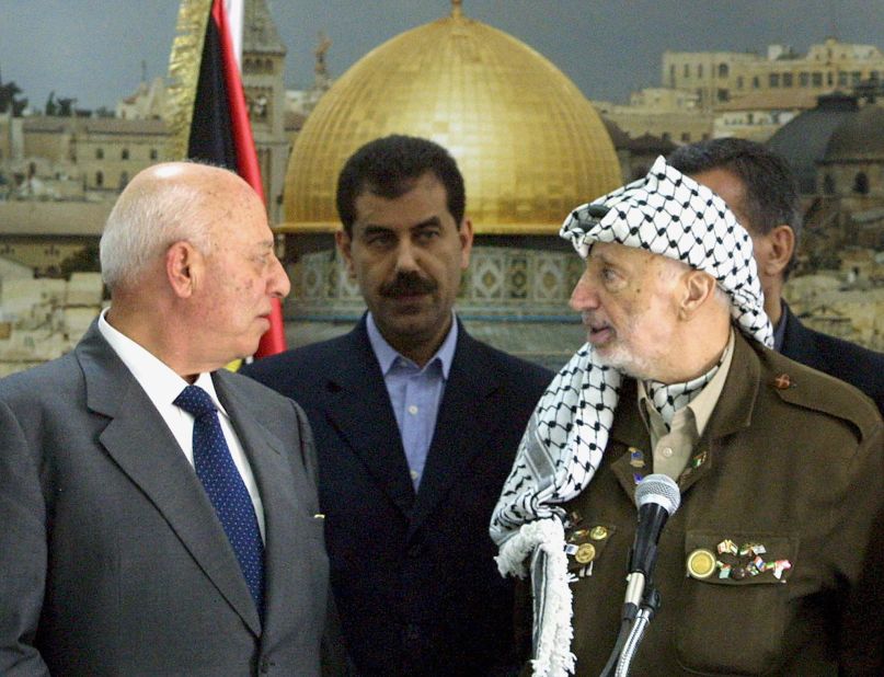 A state of emergency was declared in the Palestinian territories on October 5, 2003. Two days later, Palestinian Prime Minister Ahmed Qorei, left, and Arafat attend a swearing-in ceremony for the emergency Cabinet that was appointed.