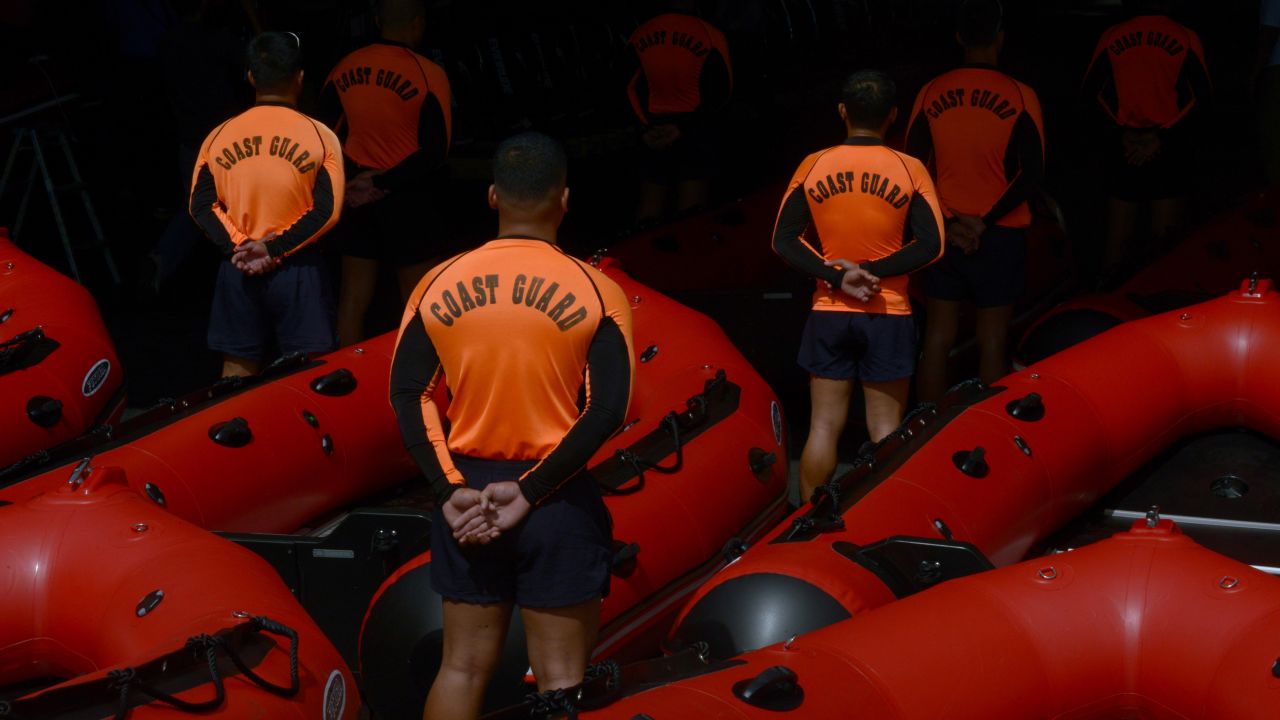 Philippine Coast Guard personnel stand in formation beside newly acquired rubber boats after a blessing ceremony in Manila on Wednesday, November 6. The boats were to be deployed to the central Philippines in preparation for Haiyan.