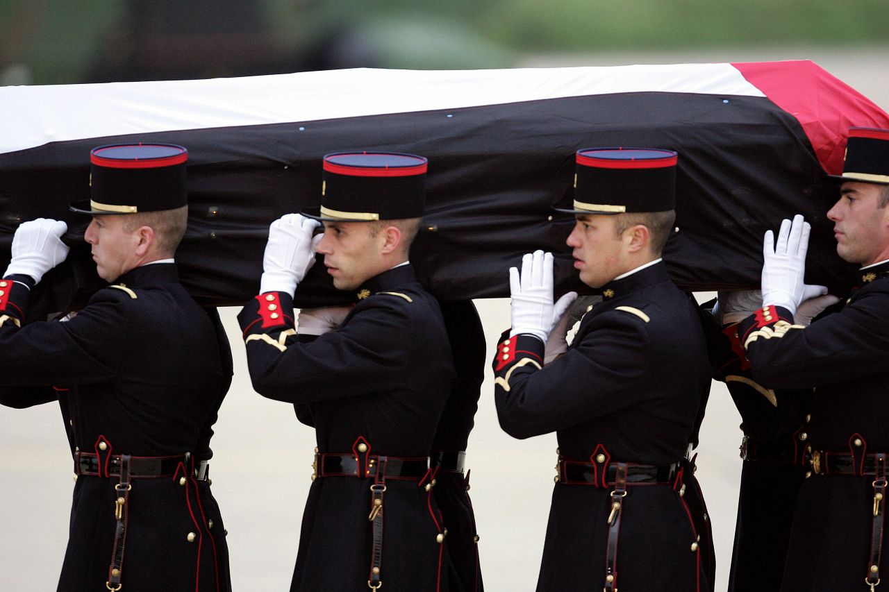 French Republican Guards transport Arafat's body to a military airport on November 11, 2004. Arafat died in a Paris hospital that day at the age of 75. The cause of his death has been disputed.