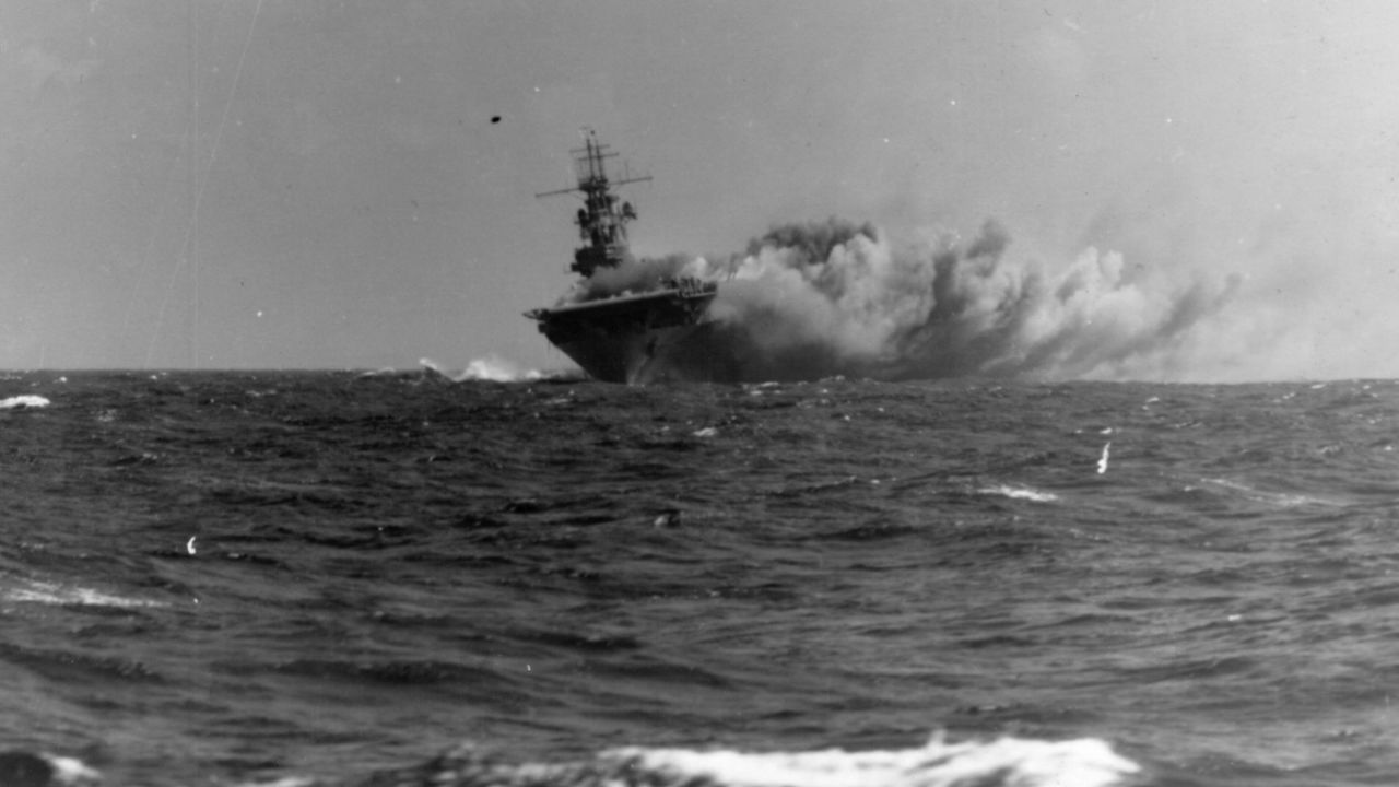 The USS Wasp burns in the Coral Sea after being struck by three torpedoes from a Japanese submarine in 1942. The ship, the only one of its class, would ultimately sink because of the damage.