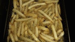 GLASGOW, UNITED KINGDOM - JUNE 07: Chips are seen cooking in a deep fat fryer at a cafe on June 7, 2006 in Glasgow, Scotland. New figures are suggesting that a large proportion of the population is clinically obese.  (Photo by Jeff J Mitchell/Getty Images)