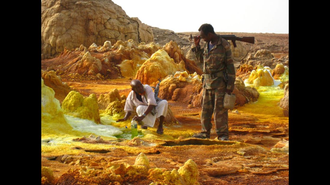 Perhaps the world's hottest place, Dinets found Afar a place difficult and dangerous to travel through. His assistants in Afar are shown here collecting volcanic acid. 