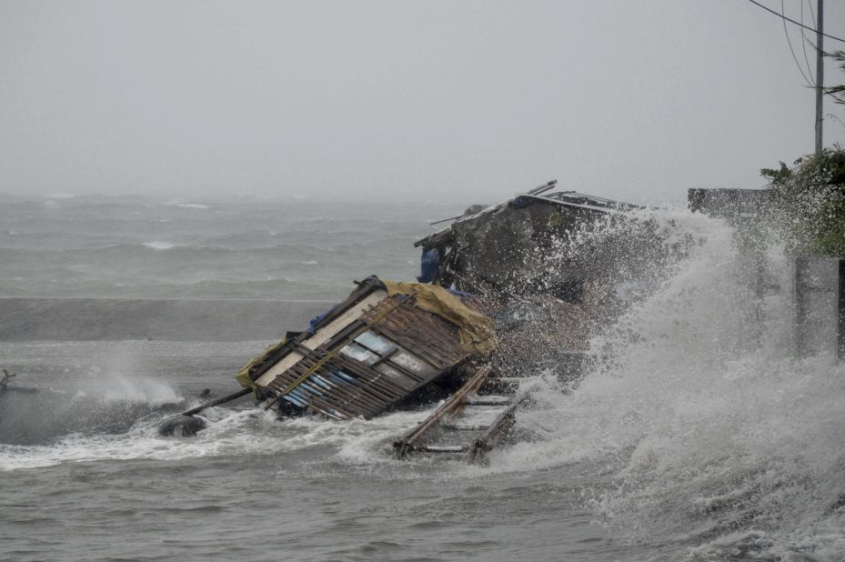 A house in Legazpi, Philippines, is engulfed by storm surge November 8.