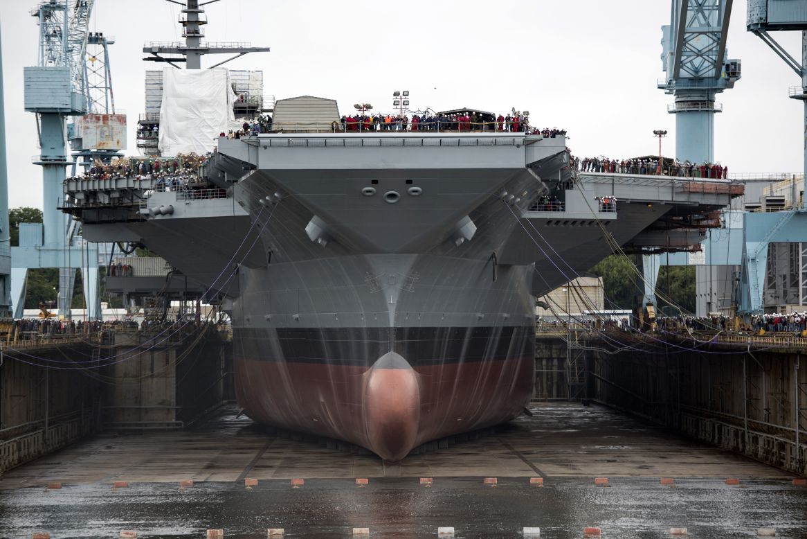 The USS Gerald Ford is the first of the Navy's newest class of aircraft carriers. Though the price of the 100,000-ton, 1,100-foot long behemoth is put at $13 billion, the Navy says the ship and others of the class will provide a savings of $5 billion over a Nimitz-class carrier during its 50-year lifespan.<br /> <br />The nuclear-powered Ford uses all electric utilities, meaning the steam catapults used to launch planes on the current Nimitz-class carriers are replaced with electromagnetic rails. The Ford is expected to be able to launch its aircraft at a rate 33% higher than Nimitz ships.<br /> <br />While the Navy says the massive carriers will be the backbone of the fleet for decades to come, some critics say improved weapons technology from U.S. adversaries could make them expensive vulnerabilities.<br /> <br />The Ford has many of its eventual crew of 4,500 aboard as its systems are tested. It is expected to be delivered to the Navy from Newport News Shipbuilding in Virginia in 2016.