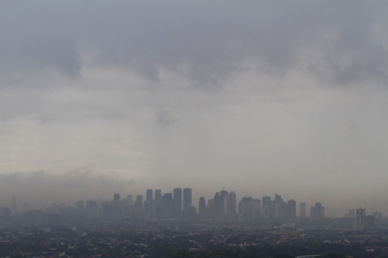 Dark clouds brought by Haiyan loom over Manila skyscrapers on November 8.