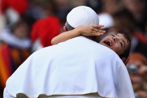 Francis embraces a young boy with cerebral palsy in March 2013 -- a gesture that many took as a heartwarming token of the Pope's self-stated desire to "be close to the people."