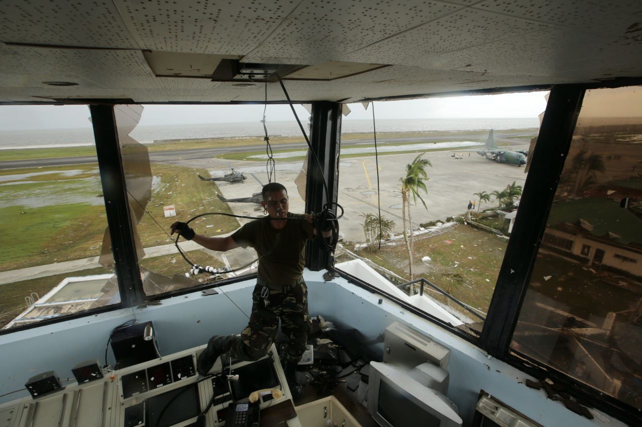 A  soldier pulls a cable inside the devastated airport tower in Tacloban. 