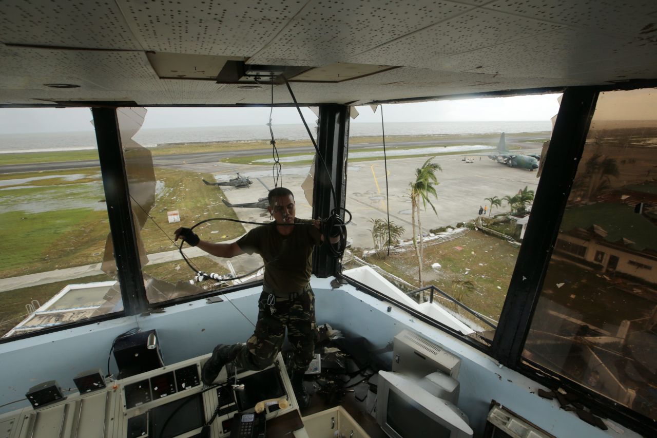 A soldier pulls a cable inside the devastated airport tower in Tacloban.